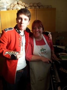 Mikey enjoys some home-cooked vegan cuisine with event organiser Linda Wardale.